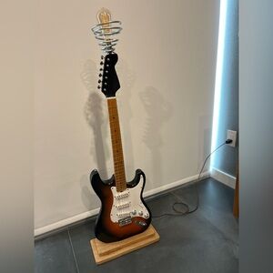 Real guitar refitted to be used as a lamp.